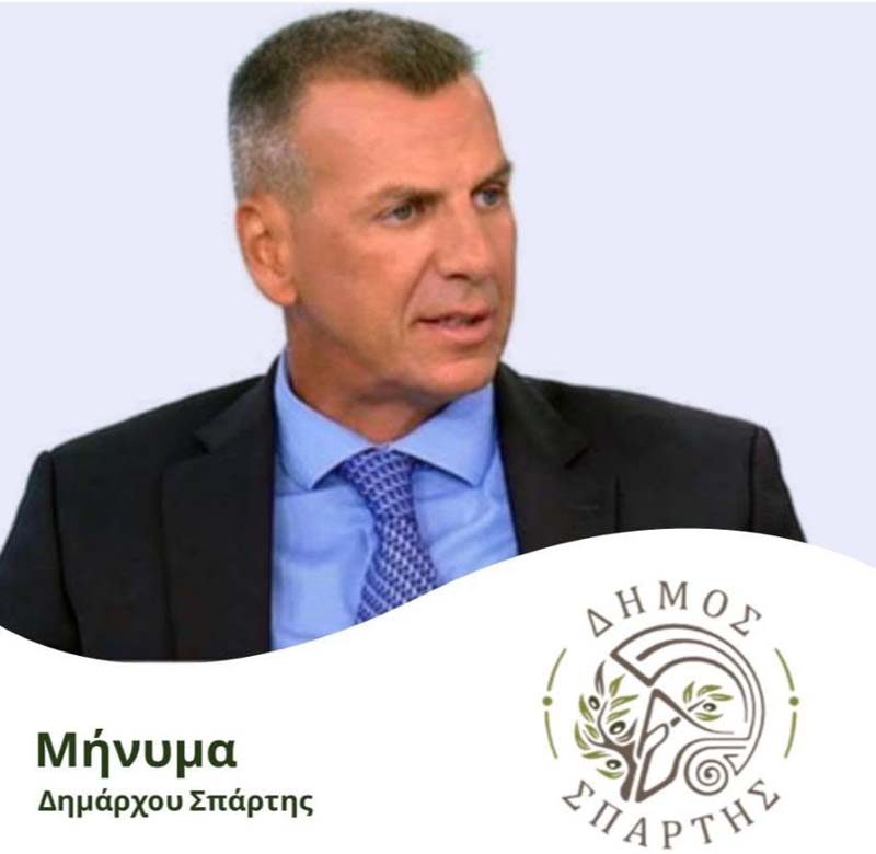 Πορτρέτο του δημάρχου Σπάρτης Μιχάλη Βακαλόπουλου μαζί με μήνυμα για το 3ο Φεστιβάλ Ελιάς και Ελαιολάδου.